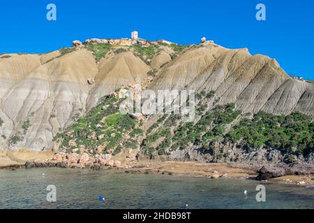 Steep blue clay slopes, with debris forming scree on coastline at Xatt l-Ahmar, Ghajnsielem, Gozo Stock Photo