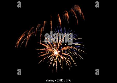 Bright flowers of festive fireworks on a dark background of the night sky Stock Photo