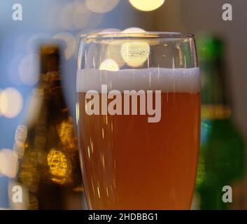Close up shot of the top of the beer can on a blurry background Stock Photo