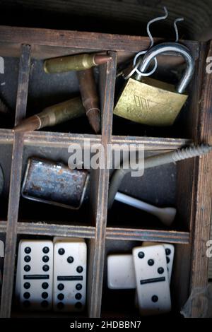 wooden box full of bric a brac Stock Photo
