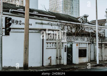 Scenic shot of an old, Asian building with white walls Stock Photo