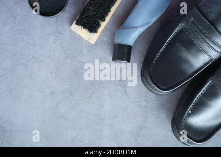 cleaning Shoe brush and shoe on black background  Stock Photo
