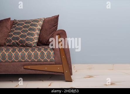 Comfortable brown sofa with cushions closeup view. Stock Photo