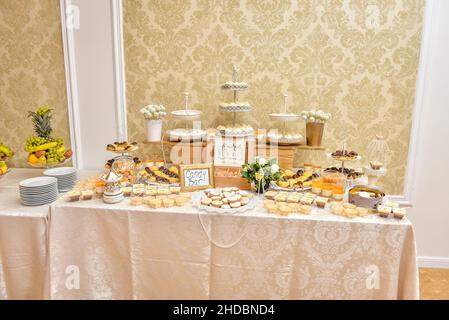 Beautiful shot of assorted desserts and beverages on a buffet table during a birthday celebration Stock Photo