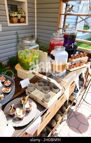 Beautiful shot of assorted desserts and beverages on a buffet table during a birthday celebration Stock Photo