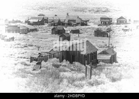 Black and white high key rendition of old town, Bodie State Park, on a cloudless day and plenty of copy-space. Bodie is a California gold mining ghost Stock Photo