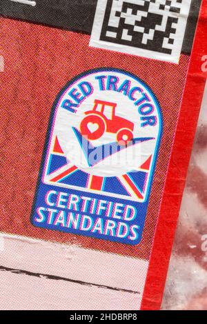 Macro of UK's Red Tractor logo / Union Jack on defrosting ASDA lean mince meat packet. For food & agriculture UK, British grown food, UK meat industry Stock Photo