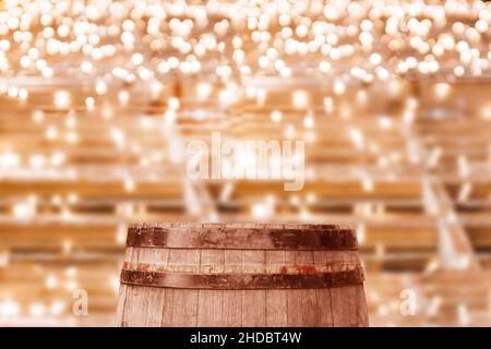 Vintage style old dark brown oak beer keg podium for products banner on bokeh bright garland decor background Stock Photo
