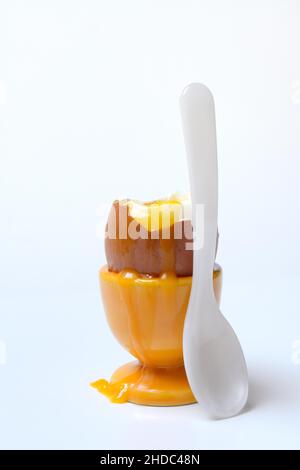 Soft boiled breakfast egg in egg cup with spoon Stock Photo