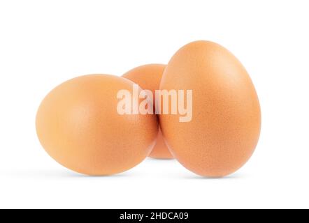 Three brown eggs isolated on white background. Close up Stock Photo