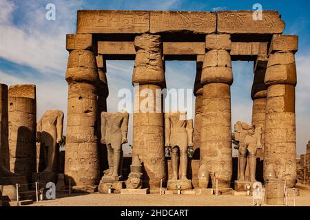 Court of Ramses II all statues show the king striding, left leg placed forward, Luxor Temple, Thebes, Egypt, Luxor, Thebes, Egypt, Africa Stock Photo