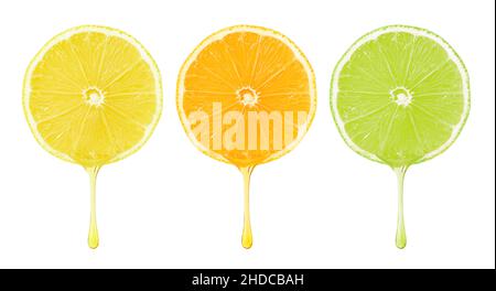 Set of citrus fruit slices with dripping drops isolated with clipping path on white background. Stock Photo