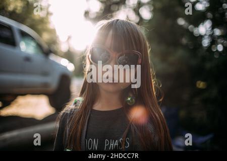 happy young girl wearing sunglasses outside Stock Photo