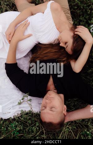 Loving wedding couple outdoor in each other's arms Stock Photo