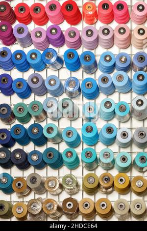 Bobbins of sewing thread in various colors. Stock Photo