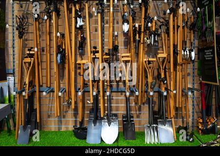 A display of Kent and Stowe carbon steel gardening tools with varnished