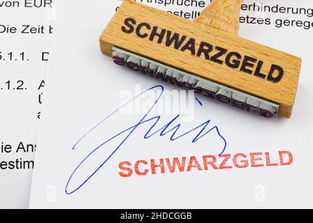 Holzstempel, Formulare im Hintergrund, Aufschrift: Schwarzgeld Stock Photo