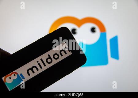 Rheinbach, Germany  2 January 2022,  The brand logo of the Japanese live stream service "Mildom" on the display of a smartphone (focus on brand logo) Stock Photo