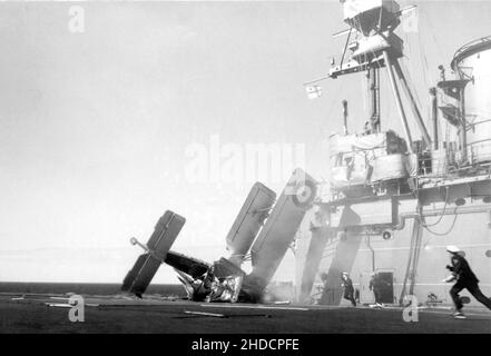 A Blackburn Shark K8466/659 aircraft of 820 squadron crashes on landing aboard the aircraft carrier HMS Courageous of the British Royal Navy on 13th October 1936 Stock Photo