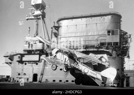 A Blackburn Shark K8466/659 aircraft of 820 squadron crashes on landing aboard the aircraft carrier HMS Courageous of the British Royal Navy on 13th October 1936 Stock Photo