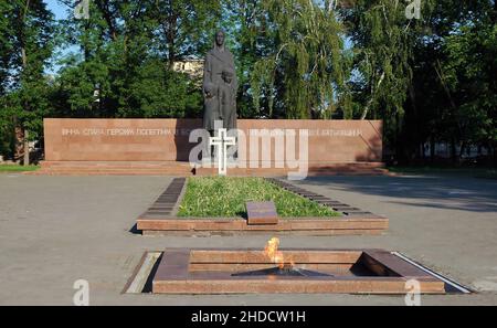 Ivano Frankivsk, Ukraine: The Fraternal cemetery or Soviet military memorial cemetery with cross and eternal flame on Bohdana Lepkoho Street. Stock Photo