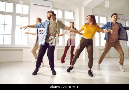 Young diverse dancers train in studio together Stock Photo