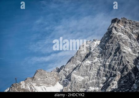 Germany's highest mountain, the Zugspitze, with the Tyrolean mountain ropeway in winter Stock Photo