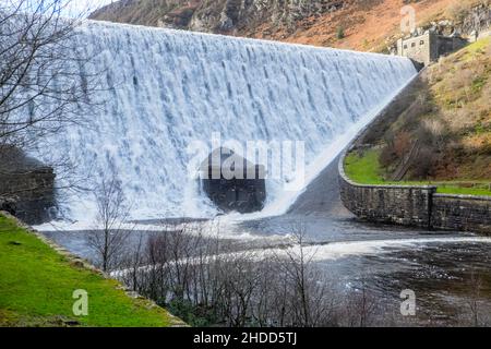 Caban Coch (Red Cabin) Dam and Reservoir,Height 37m Length 186m. It was designed to look like a waterfall,overflowing after heavy rain.Elan Valley, Elan Valley Estate,owned,by,Dwr Cymru,Welsh Water,west, of,Rhayader, Powys,Mid,West Wales,Welsh,Elan Valley,is,1% of Wales,covers,an,area,of,72,square,miles,and,is,known,as,Lake District, of Wales,Lake District of Wales, There are 6 dams in the area creating reservoirs that were built a hundred years ago,and,are,an,epic,feat,of,civil,engineering,feeding into a 73 mile gravity driven aqueduct to supply clean water to the city of Birmingham,England. Stock Photo