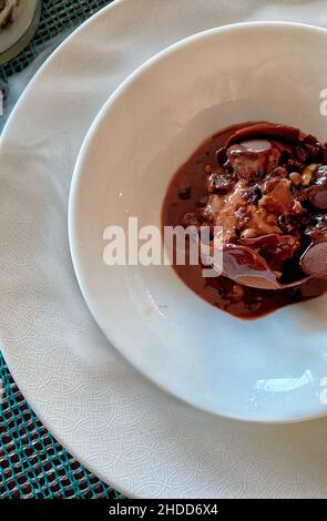 Top view of a plate of melted chocolate dessert Stock Photo