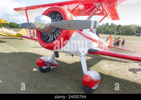 Vintage Red Baron Squadron double winged bi-plane at the 'Gathering of Planes' on the Municipal Airport field. Battle Lake Minnesota MN USA Stock Photo
