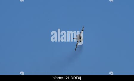 Thiene Italy OCTOBER, 16, 2021 Ground attack airplane in flight armed in the blue sky. Copy Space. AMX Ghibli of Italian Air Force subsonic military fighter jet aircraft Stock Photo