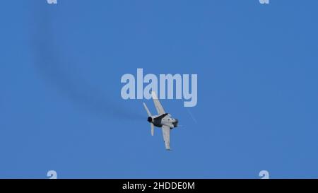 Thiene Italy OCTOBER, 16, 2021 Ground attack airplane in flight armed in the blue sky. Copy Space. AMX Ghibli of Italian Air Force subsonic military fighter jet aircraft Stock Photo