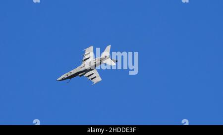 Thiene Italy OCTOBER, 16, 2021 Ground attack airplane in flight armed in the blue sky. Copy Space. AMX Ghibli of Italian Air Force subsonic military fighter jet aircraft Stock Photo