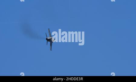 Thiene Italy OCTOBER, 16, 2021 Ground attack airplane in flight armed in the blue sky. Copy Space. AMX Ghibli of Italian Air Force subsonic military fighter jet aircraft Stock Photo