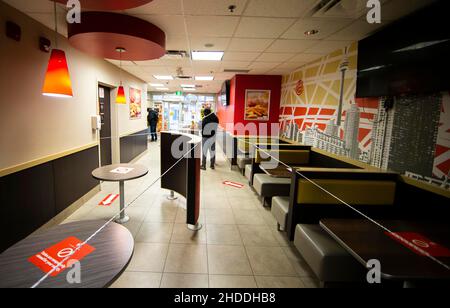 Toronto, Canada. 5th Jan, 2022. The closed dining area of a Burger King is seen in Toronto, Ontario, Canada, on Jan. 5, 2022. In response to recent trends that show an alarming increase in COVID-19 hospitalizations, the Ontario government on Wednesday started to impose measures to blunt transmission of the virus for at least 21 days, including closing gyms, theaters, cinemas, museums, galleries and banning indoor dining at restaurants. Credit: Zou Zheng/Xinhua/Alamy Live News Stock Photo