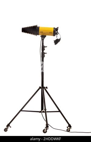 Flash strobe with snoot light modificator on stand with wheels. Studio lighting equipment isolated on white background. Stock Photo