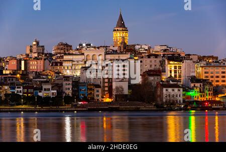 Karakoy and Galata Tower from Golden Horn Bay in twilight, Istanbul, Turkey Stock Photo