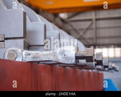 Locking device for the bridge of an industrial twin screw press. Stock Photo