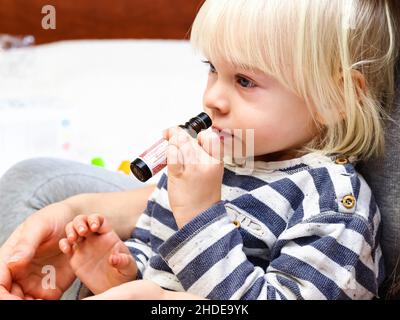 kid learning essential oils doterra kids set.belarus,minsk,2021.therapeutic grade essential oils at a health lecture Stock Photo