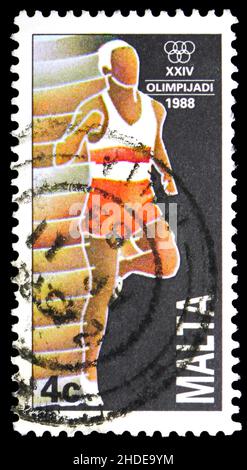 MOSCOW, RUSSIA - NOVEMBER 4, 2021: Postage stamp printed in Malta shows Athletics, Summer Olympic Games 1988 - Seoul serie, circa 1988 Stock Photo