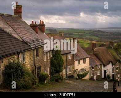Famous view of the cobbled street and cottages of Gold Hill Shaftesbury Dorset south west England Stock Photo