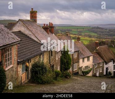 Famous view of the cobbled street and cottages of Gold Hill Shaftesbury Dorset south west England Stock Photo