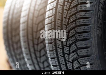 Set of winter tires prepared to be changed on a vehicle. Stock Photo