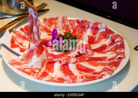 A plate of fresh hot pot dishes, beef slices Stock Photo