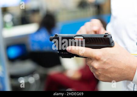 hand holding a semi automatic handgun Stock Photo