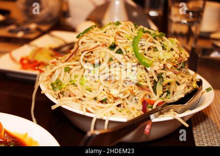 Chow mein are Chinese stir-fried noodles with vegetables and sometimes meat or tofu Stock Photo