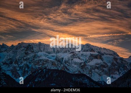 clouds illuminated by the sun at dawn over the Sella group, Dolomites Stock Photo