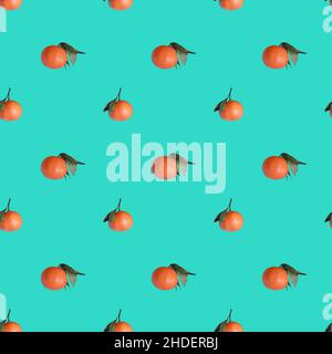 Seamless pattern with ripe orange tangerines on turquoise background Stock Photo