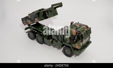 Closeup of a miniature M142 High Mobility Artillery Rocket System isolated on a white background Stock Photo