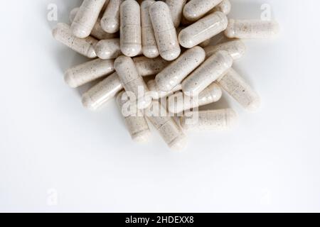 White multivitamin detail supplements isolated on white background. Stock Photo